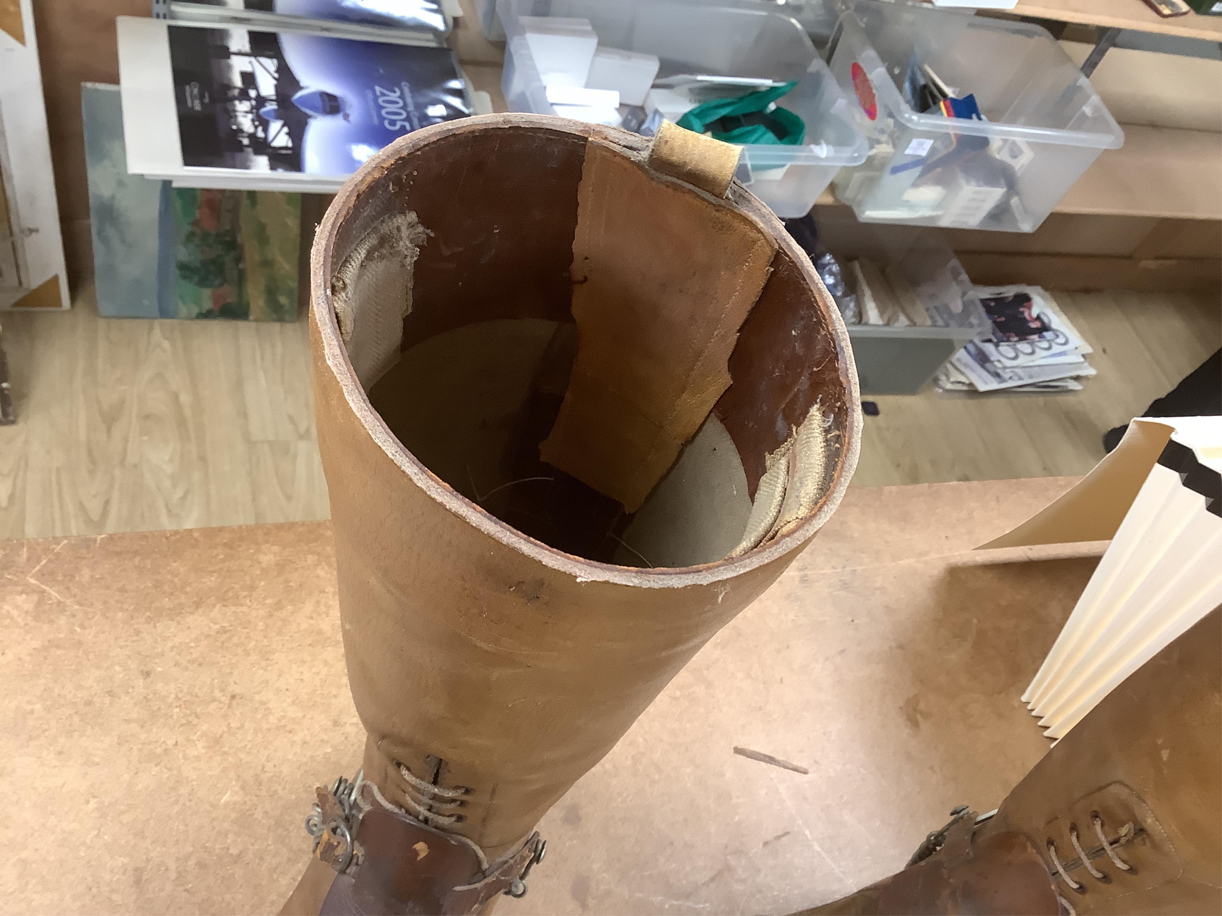 A pair of military First World War boots in tan leather, hobnail soles, two-part wooden shoe trees, and spurs. Condition - fair to good, some rubbing, fading and staining to the leather